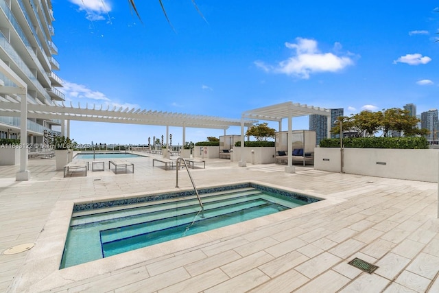 4250 Biscayne Blvd Unit 1218, Miami, FL 33137 - community pool with a hot tub, a pergola, and a patio