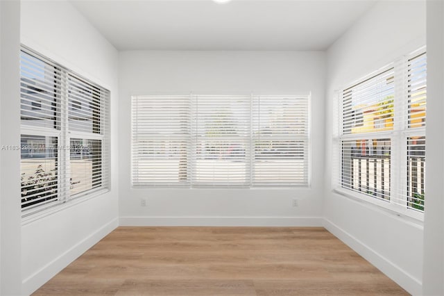 403 SW 12th Ave, Miami, FL 33130 - empty room with plenty of natural light and light wood-type flooring