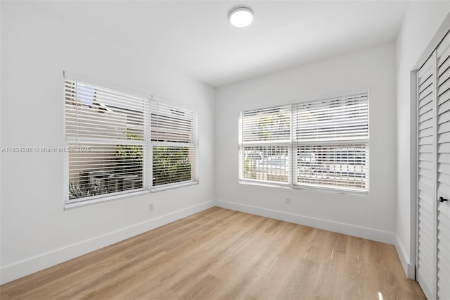 403 SW 12th Ave, Miami, FL 33130 - unfurnished room featuring baseboards and light wood-style flooring