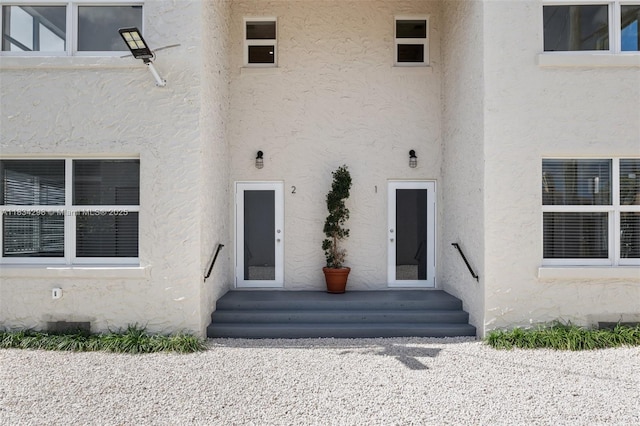 403 SW 12th Ave, Miami, FL 33130 - doorway to property with stucco siding and crawl space