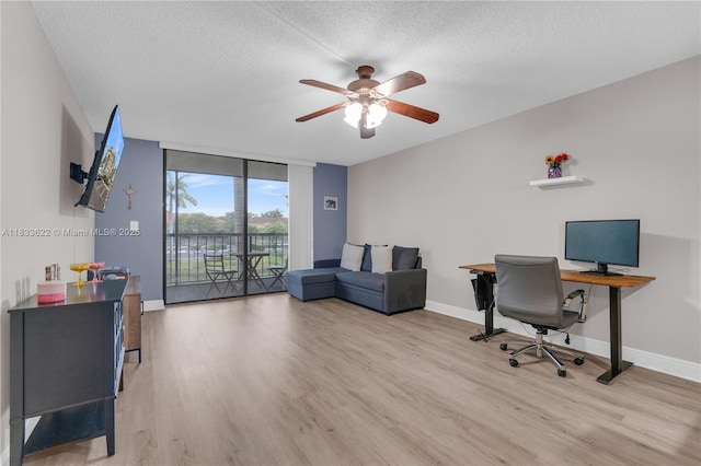6193 Rock Island Rd Unit 216, Tamarac, FL 33319 - office space featuring wood finished floors, a ceiling fan, and a textured ceiling