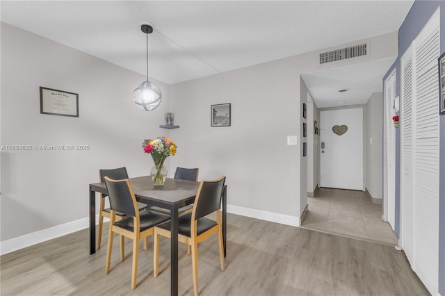 6193 Rock Island Rd Unit 216, Tamarac, FL 33319 - dining room with light wood-style floors and baseboards