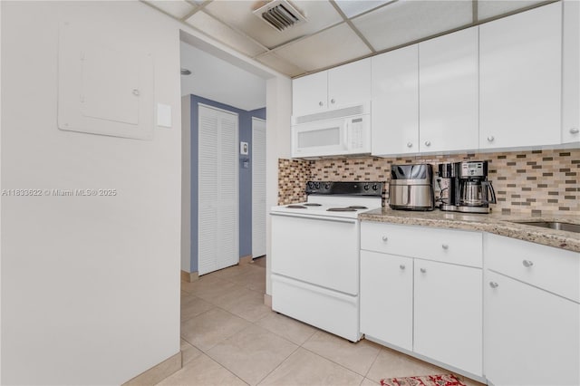 6193 Rock Island Rd Unit 216, Tamarac, FL 33319 - kitchen featuring white appliances, tasteful backsplash, and light tile patterned floors