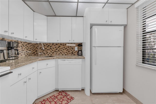 6193 Rock Island Rd Unit 216, Tamarac, FL 33319 - kitchen with white appliances, backsplash, white cabinetry, light tile patterned floors, and a drop ceiling