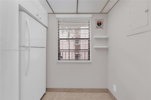 6193 Rock Island Rd Unit 216, Tamarac, FL 33319 - unfurnished bedroom with freestanding refrigerator and light tile patterned flooring