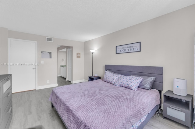 6193 Rock Island Rd Unit 216, Tamarac, FL 33319 - bedroom featuring wood finished floors and baseboards