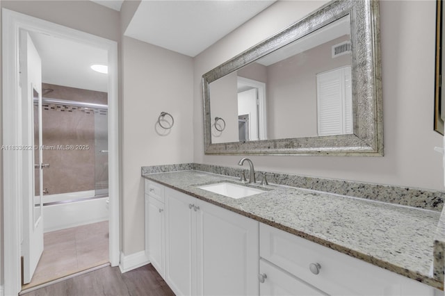 6193 Rock Island Rd Unit 216, Tamarac, FL 33319 - bathroom featuring vanity, wood finished floors, and shower / tub combination
