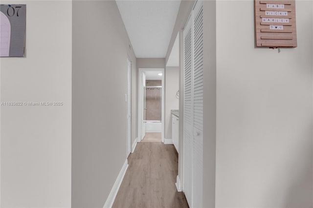 6193 Rock Island Rd Unit 216, Tamarac, FL 33319 - hall with wood finished floors and baseboards