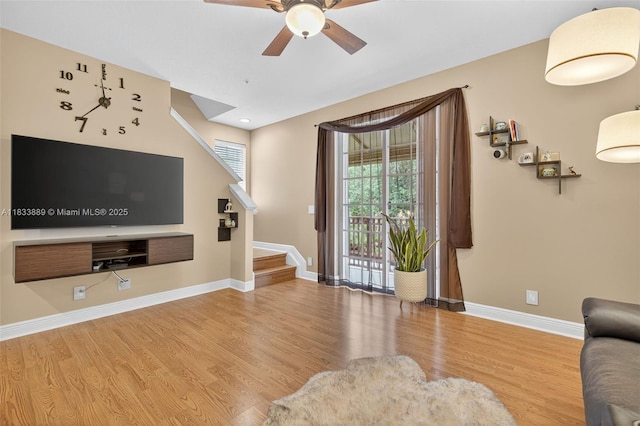 153 Apalachee Ln, Jupiter, FL 33458 - living area with ceiling fan, wood finished floors, and stairway