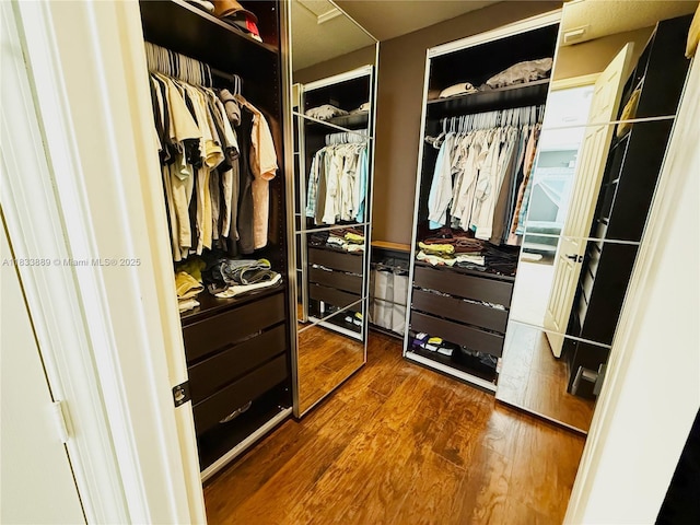 153 Apalachee Ln, Jupiter, FL 33458 - walk in closet featuring dark wood-style floors