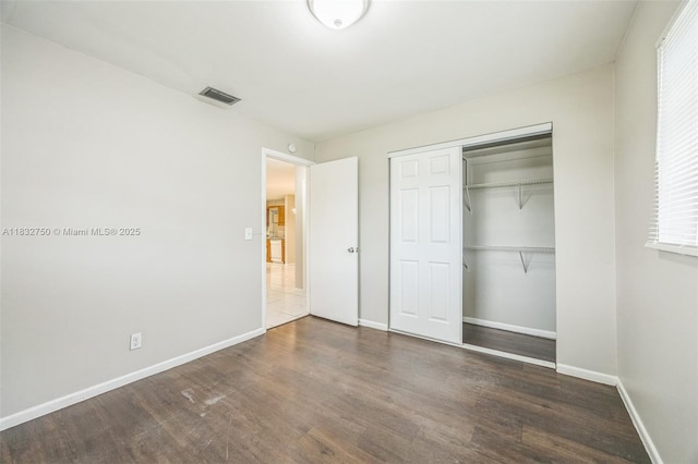 4931 NW 13th St, Lauderhill, FL 33313 - unfurnished bedroom featuring wood finished floors and a closet