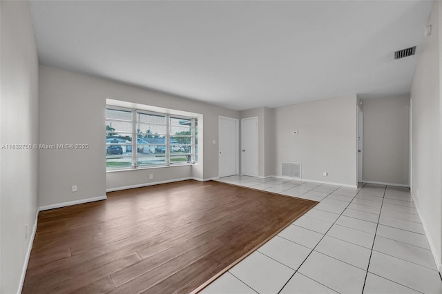 4931 NW 13th St, Lauderhill, FL 33313 - empty room featuring baseboards and light wood-style floors