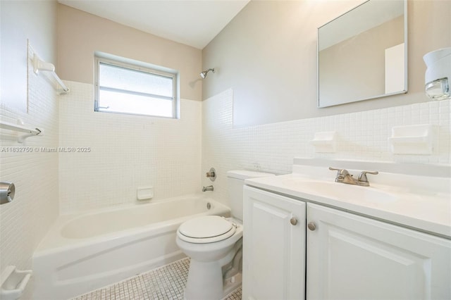 4931 NW 13th St, Lauderhill, FL 33313 - bathroom with shower / bathtub combination, tile walls, vanity, tile patterned floors, and a wainscoted wall