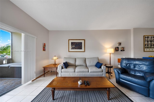 4330 Hillcrest Dr Unit 104, Hollywood, FL 33021 - living room featuring light tile patterned floors and a textured ceiling