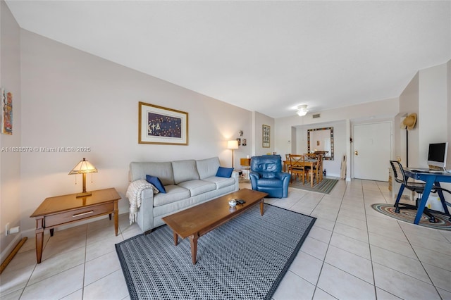 4330 Hillcrest Dr Unit 104, Hollywood, FL 33021 - living room featuring light tile patterned floors and baseboards