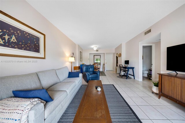 4330 Hillcrest Dr Unit 104, Hollywood, FL 33021 - living room featuring light tile patterned floors and baseboards