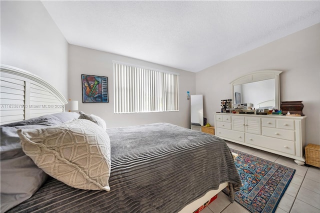 4330 Hillcrest Dr Unit 104, Hollywood, FL 33021 - bedroom with light tile patterned flooring and a textured ceiling