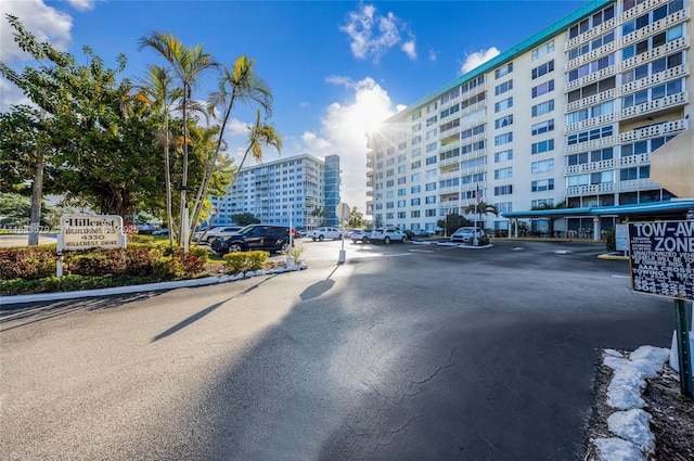 4330 Hillcrest Dr Unit 104, Hollywood, FL 33021 - view of asphalt street featuring traffic signs, curbs, and street lights