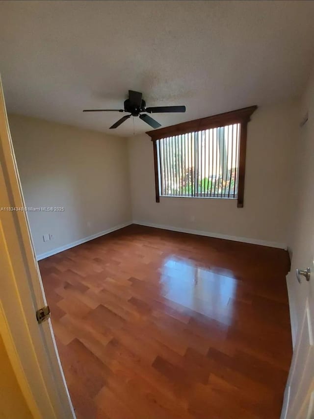 3995 W Mcnab Rd Unit B105, Pompano Beach, FL 33069 - empty room featuring wood finished floors and ceiling fan