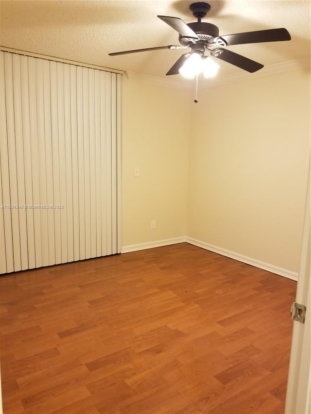 3995 W Mcnab Rd Unit B105, Pompano Beach, FL 33069 - empty room with light wood-style flooring, a ceiling fan, ornamental molding, and a textured ceiling