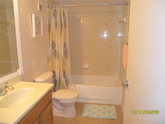 3995 W Mcnab Rd Unit B105, Pompano Beach, FL 33069 - bathroom featuring vanity, shower / bath combo with shower curtain, and tile patterned floors