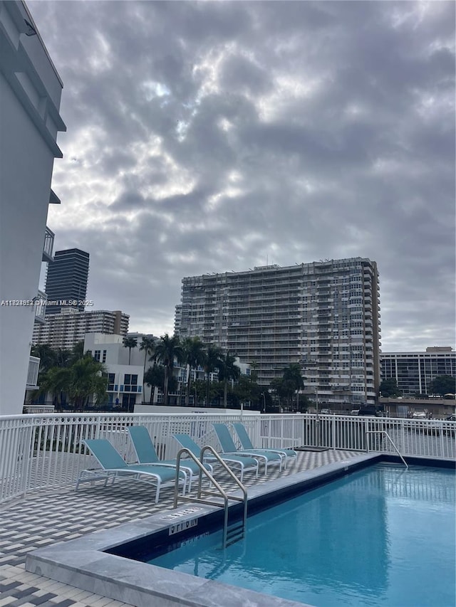 1913 S Ocean Dr Unit 302, Hallandale Beach, FL 33009 - community pool featuring a patio area