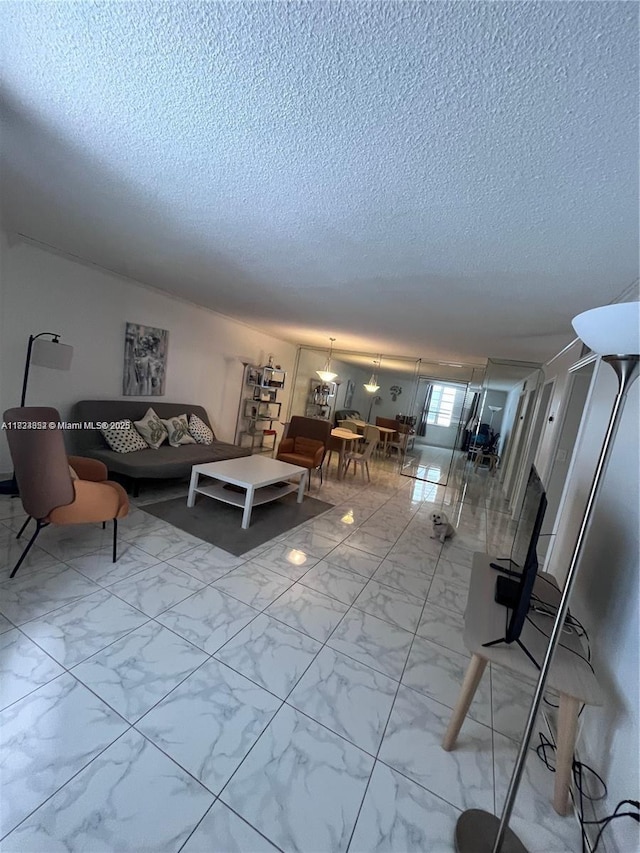 1913 S Ocean Dr Unit 302, Hallandale Beach, FL 33009 - living area with a textured ceiling and light marble finish flooring