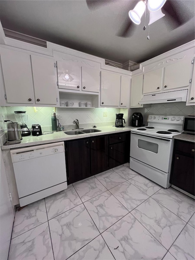 1913 S Ocean Dr Unit 302, Hallandale Beach, FL 33009 - kitchen with white appliances, light marble finish flooring, under cabinet range hood, open shelves, and white cabinets