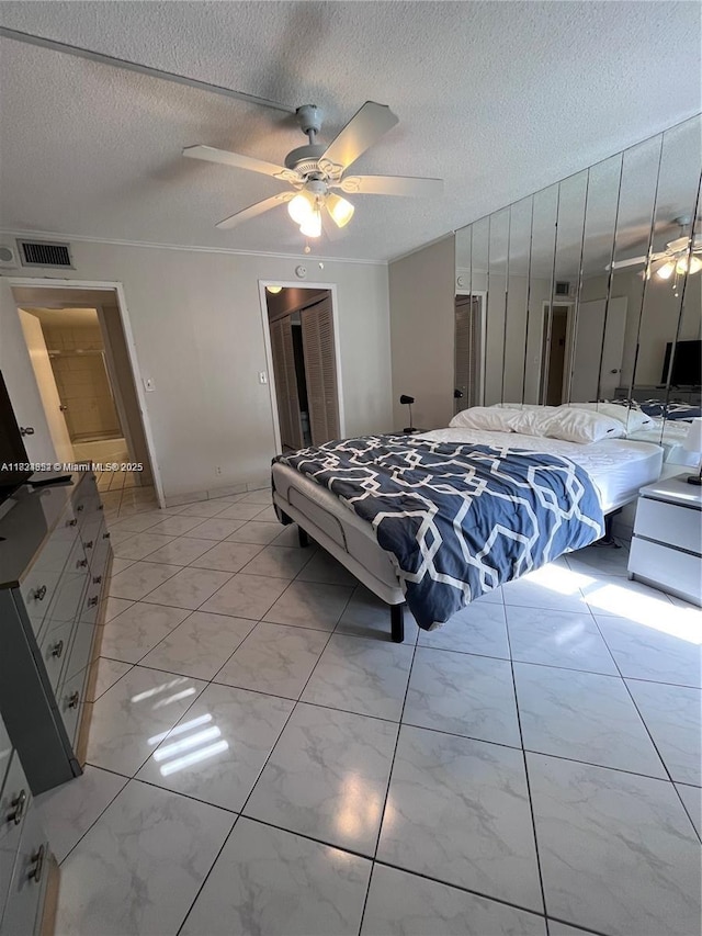 1913 S Ocean Dr Unit 302, Hallandale Beach, FL 33009 - bedroom with light marble finish flooring, a textured ceiling, a closet, and ceiling fan
