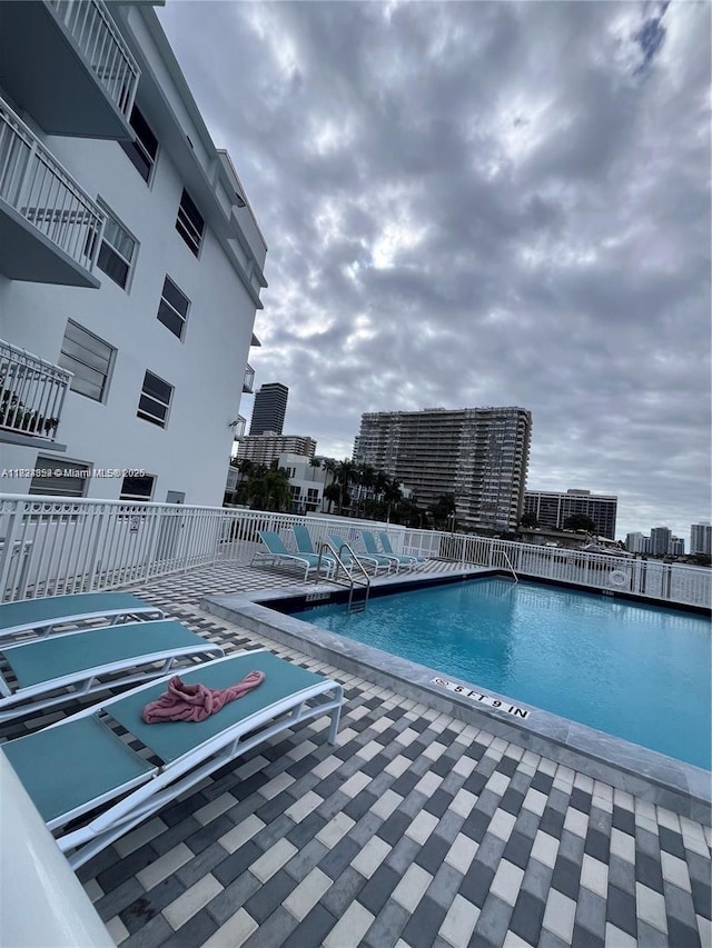 1913 S Ocean Dr Unit 302, Hallandale Beach, FL 33009 - community pool with a patio and a view of city