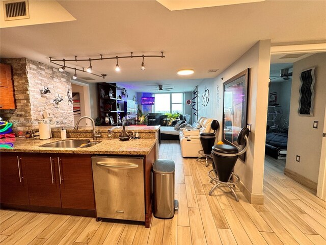 2641 N Flamingo Rd Unit 1203N, Sunrise, FL 33323 - kitchen featuring a ceiling fan, stainless steel dishwasher, light wood-style floors, open floor plan, and rail lighting