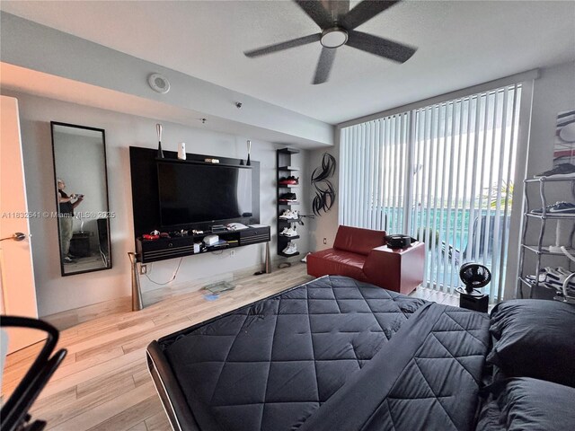 2641 N Flamingo Rd Unit 1203N, Sunrise, FL 33323 - bedroom featuring wood finished floors, access to exterior, and a ceiling fan