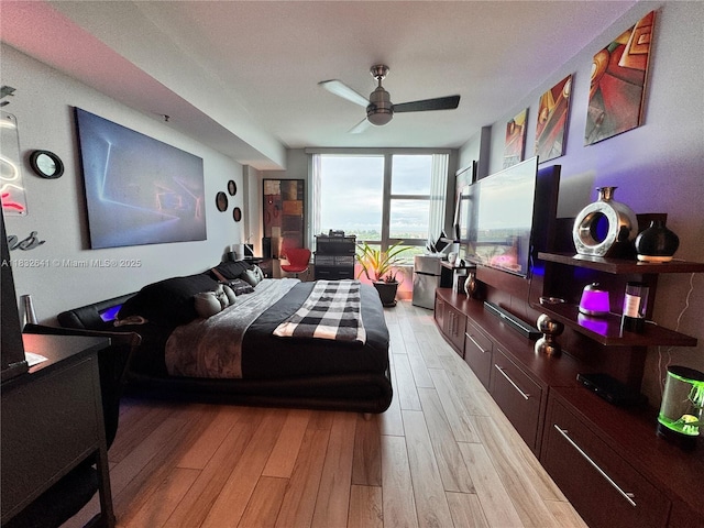 2641 N Flamingo Rd Unit 1203N, Sunrise, FL 33323 - bedroom featuring light wood-type flooring, expansive windows, and a ceiling fan