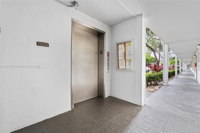 251 SW 132nd Way Unit 201H, Pembroke Pines, FL 33027 - view of exterior entry featuring elevator
