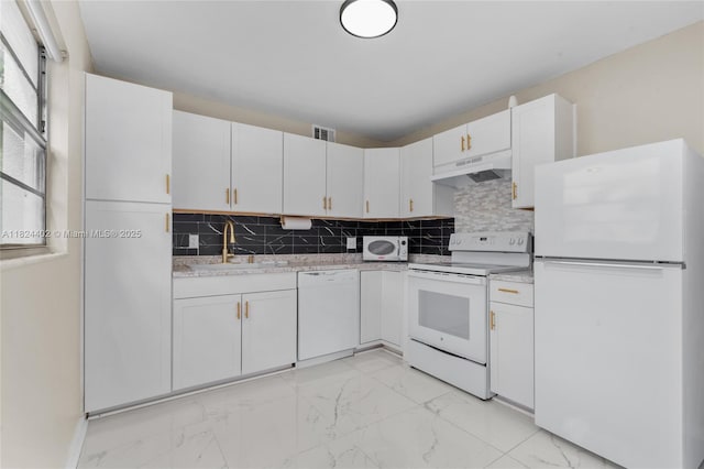 251 SW 132nd Way Unit 201H, Pembroke Pines, FL 33027 - kitchen with white appliances, under cabinet range hood, light marble finish floors, light countertops, and tasteful backsplash