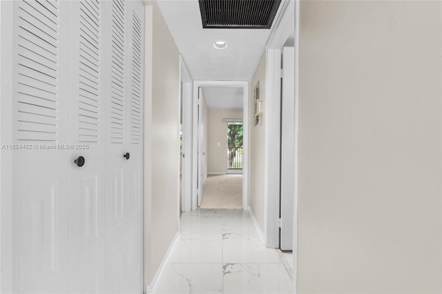 251 SW 132nd Way Unit 201H, Pembroke Pines, FL 33027 - corridor featuring light marble finish floors and baseboards
