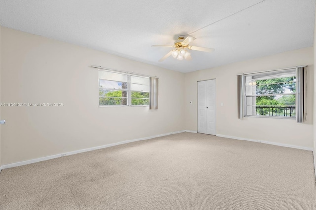 251 SW 132nd Way Unit 201H, Pembroke Pines, FL 33027 - carpeted empty room featuring healthy amount of natural light and ceiling fan