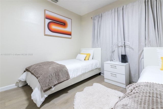 2270 Havana Dr, Miramar, FL 33023 - bedroom with baseboards and light wood-type flooring