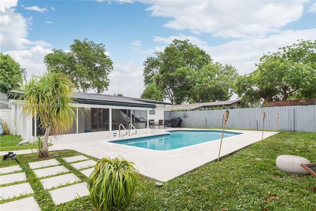 2270 Havana Dr, Miramar, FL 33023 - view of swimming pool with a patio, a fenced backyard, and a sunroom