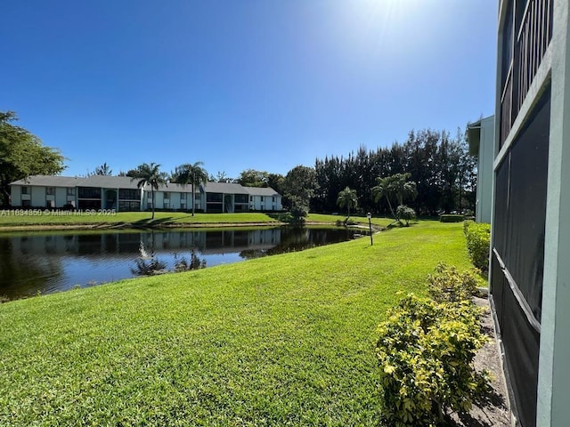 3606 Alder Dr Unit F2, West Palm Beach, FL 33417 - view of grassy yard featuring a water view