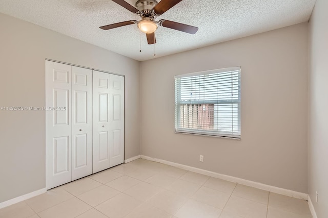 11035 NW 27th St, Sunrise, FL 33322 - unfurnished bedroom featuring a closet, a textured ceiling, ceiling fan, and light tile patterned floors
