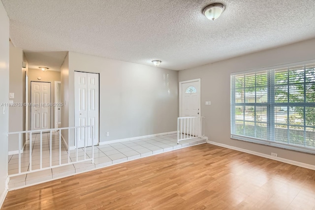 11035 NW 27th St, Sunrise, FL 33322 - unfurnished room with wood finished floors and a textured ceiling
