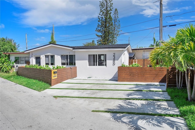2380 NE 137th St, North Miami Beach, FL 33181 - view of front facade with stucco siding
