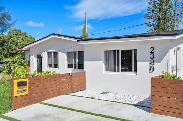2380 NE 137th St, North Miami Beach, FL 33181 - view of front of home with stucco siding