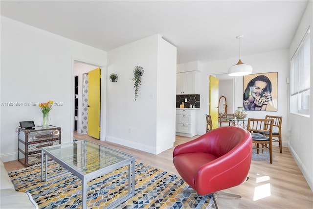 2380 NE 137th St, North Miami Beach, FL 33181 - living room featuring light wood-style floors and baseboards