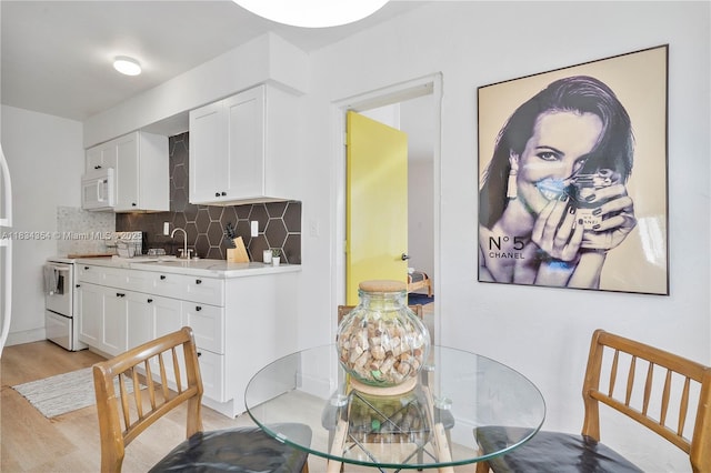 2380 NE 137th St, North Miami Beach, FL 33181 - dining space with light wood-style flooring