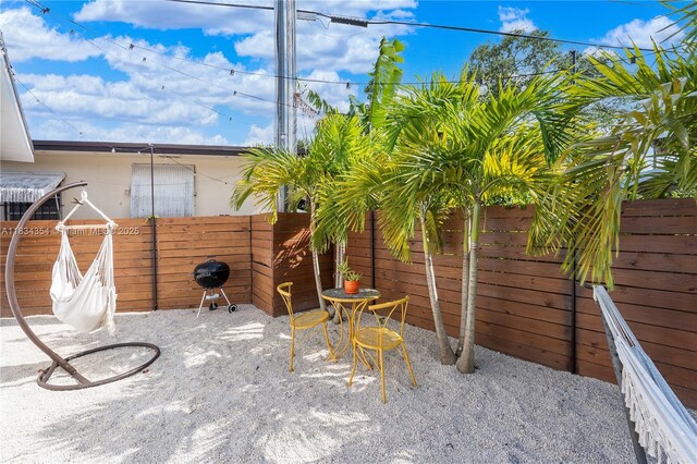 2380 NE 137th St, North Miami Beach, FL 33181 - fenced backyard with a patio and area for grilling