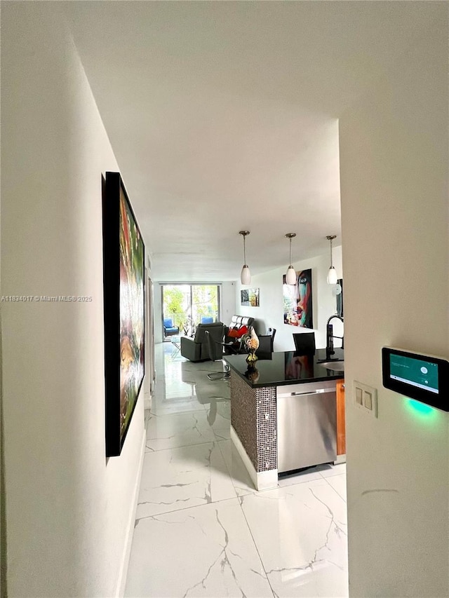 680 NE 64th St Unit A501, Miami, FL 33138 - kitchen with dishwasher, light marble finish flooring, and hanging light fixtures