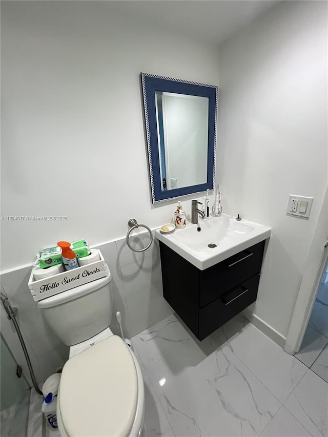 680 NE 64th St Unit A501, Miami, FL 33138 - bathroom with vanity and marble look tile flooring