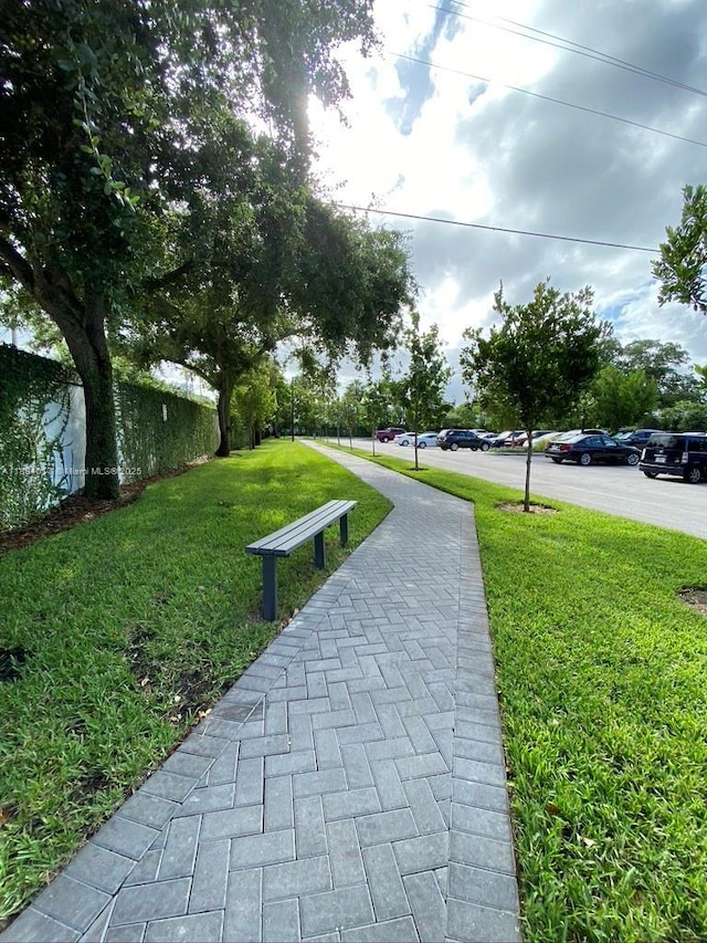 680 NE 64th St Unit A501, Miami, FL 33138 - surrounding community with a lawn